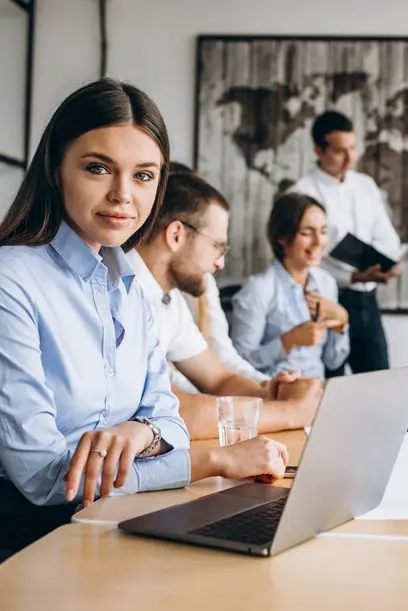 Group of people working out business plan in an office<br />