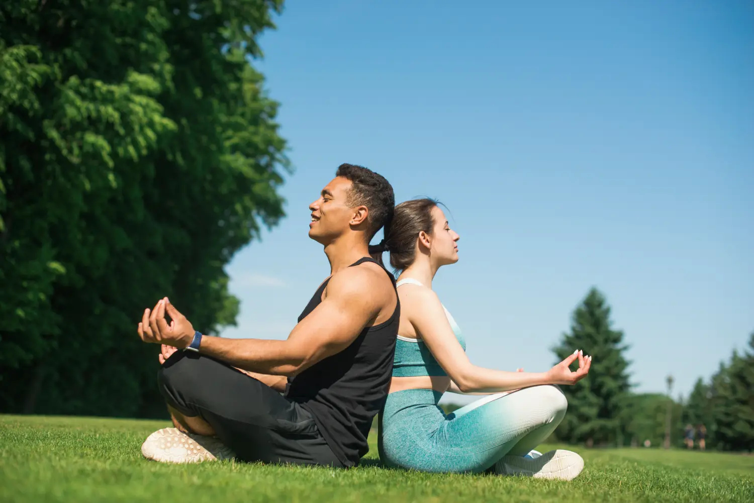 man-woman-practicing-yoga-outdoor