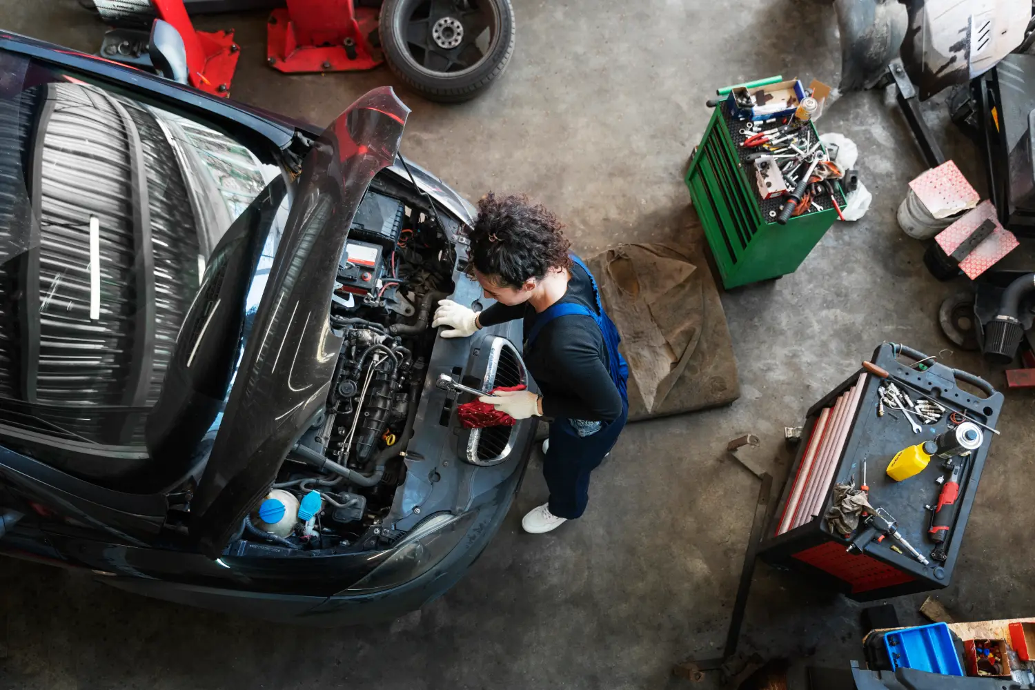 top-view-woman-repairing-car